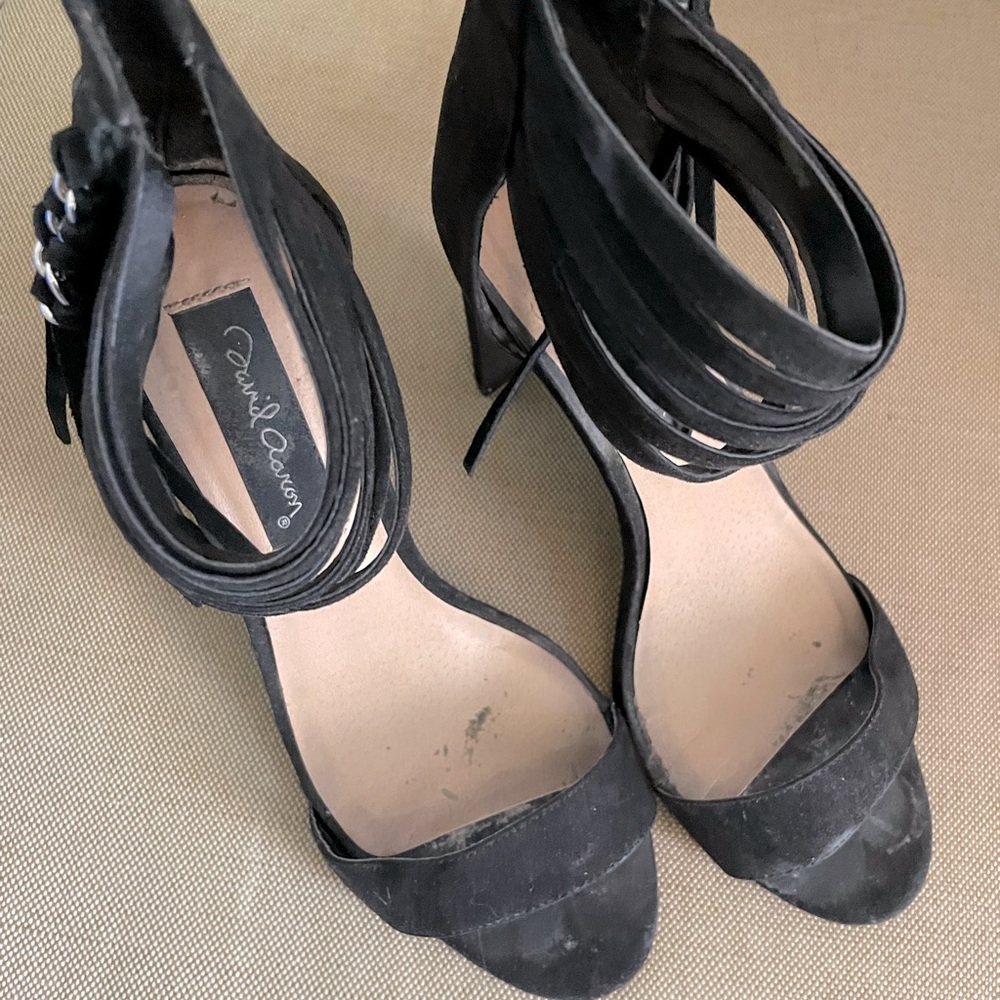 Woman’s high heel sandal with zipper back.